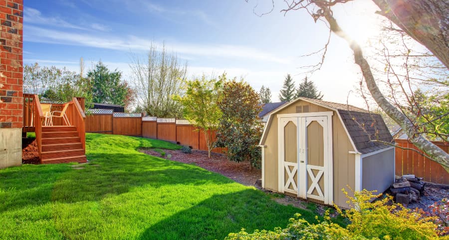 Fenced backyard with storage shed in Ann Arbor